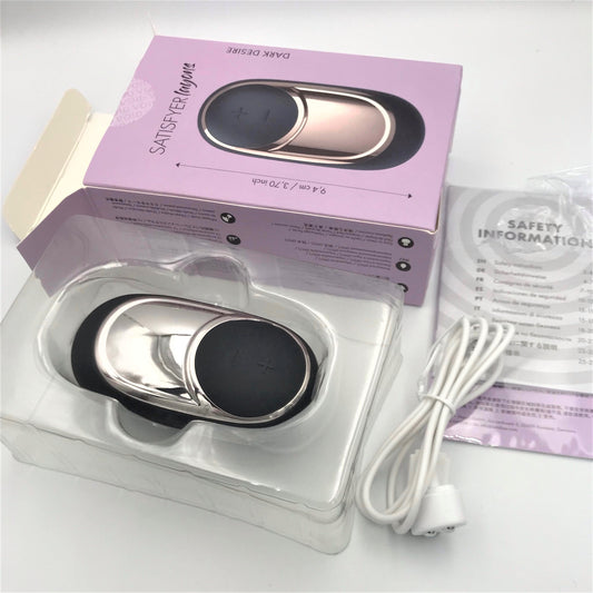Uitgepakte Satisfyer Dark Desire Layons met doos, oplaadkabel en veiligheidsinformatie